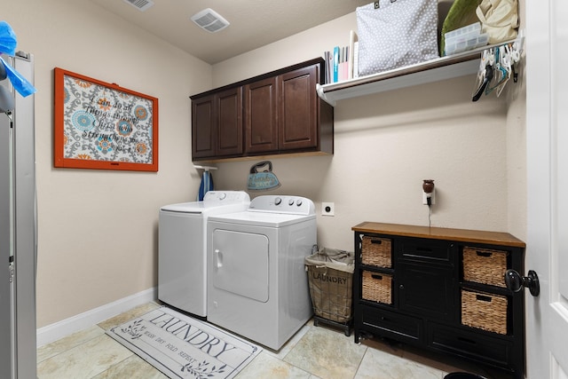 2322 Dolan Springs Ln, Friendswood, TX 77546 - laundry room featuring cabinet space, washer and dryer, light tile patterned floors, and baseboards