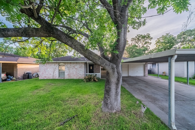 751 Terryhollow St, Channelview, TX 77530 - ranch-style house featuring brick siding, a front yard, concrete driveway, and a garage