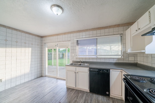 751 Terryhollow St, Channelview, TX 77530 - kitchen featuring black appliances, a sink, a textured ceiling, light wood-style flooring, and white cabinetry