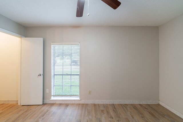 751 Terryhollow St, Channelview, TX 77530 - empty room featuring wood finished floors, ceiling fan, and baseboards