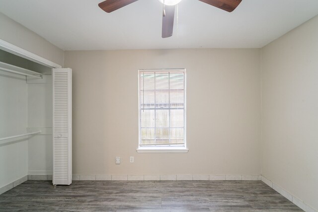 751 Terryhollow St, Channelview, TX 77530 - unfurnished bedroom featuring a closet, wood finished floors, a ceiling fan, and baseboards
