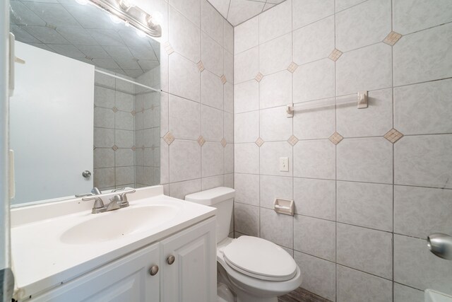 751 Terryhollow St, Channelview, TX 77530 - bathroom featuring toilet, vanity, and tile walls
