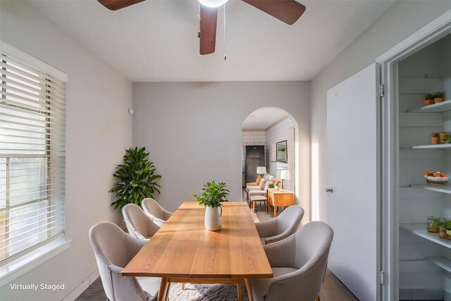751 Terryhollow St, Channelview, TX 77530 - dining space featuring arched walkways, ceiling fan, and wood finished floors