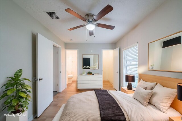751 Terryhollow St, Channelview, TX 77530 - bedroom with light wood-style floors, connected bathroom, and a ceiling fan