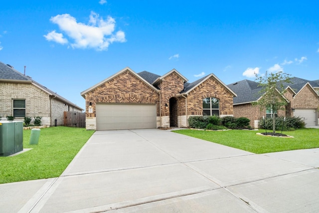 519 Newcomb Hollow Dr, Conroe, TX 77304 - view of front of house featuring a garage, brick siding, driveway, cooling unit, and roof with shingles