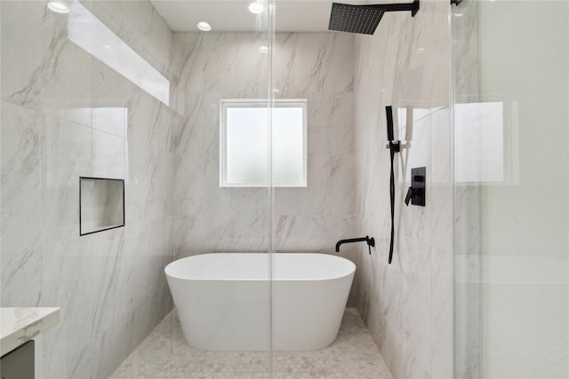 4629 Balkin St, Houston, TX 77021 - bathroom with a marble finish shower, a freestanding tub, vanity, and tile walls