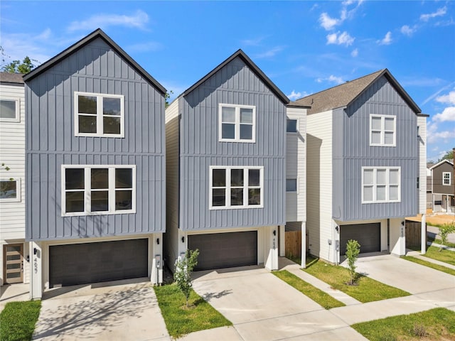 4629 Balkin St, Houston, TX 77021 - view of front of home with a garage, concrete driveway, and board and batten siding