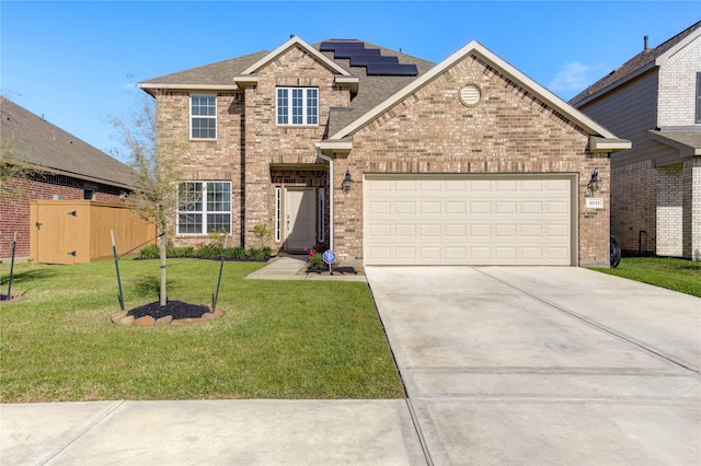 3033 Myrtle Sunset Dr, Katy, TX 77493 - view of front of house featuring concrete driveway, brick siding, a garage, a front yard, and solar panels