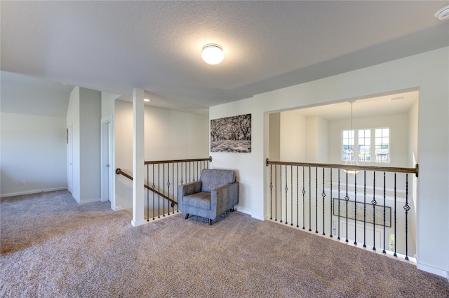3033 Myrtle Sunset Dr, Katy, TX 77493 - living area with carpet flooring, an upstairs landing, a chandelier, baseboards, and a textured ceiling