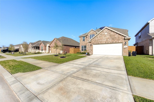 3033 Myrtle Sunset Dr, Katy, TX 77493 - traditional home featuring brick siding, concrete driveway, an attached garage, a residential view, and roof mounted solar panels