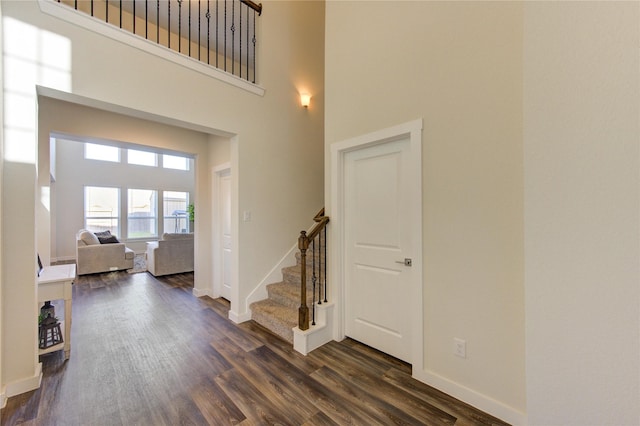 3033 Myrtle Sunset Dr, Katy, TX 77493 - staircase featuring a high ceiling, wood finished floors, and baseboards