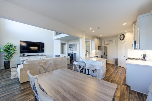 3033 Myrtle Sunset Dr, Katy, TX 77493 - dining area with recessed lighting, dark wood-type flooring, baseboards, and radiator