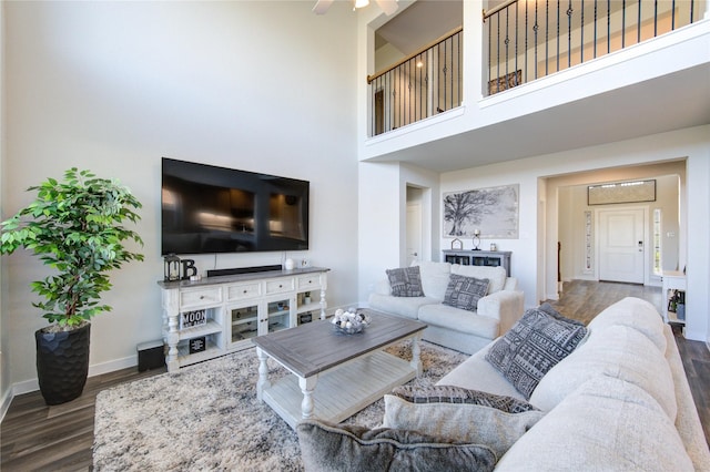 3033 Myrtle Sunset Dr, Katy, TX 77493 - living area featuring wood finished floors, baseboards, a high ceiling, and a ceiling fan