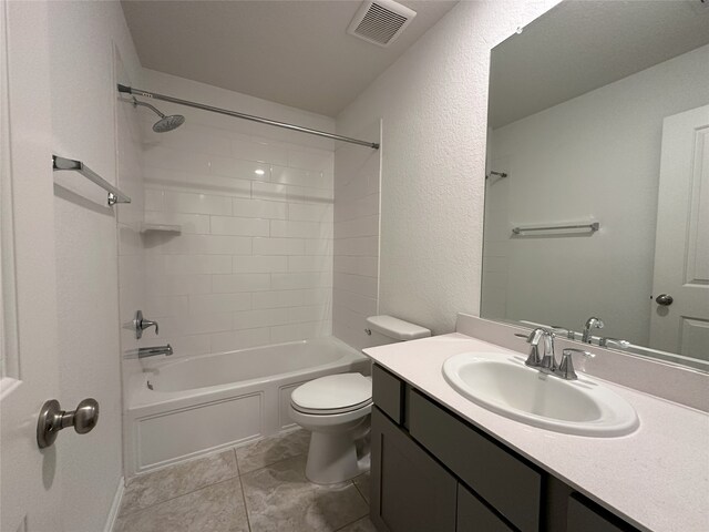 130 Moon Dance Ct, Conroe, TX 77304 - bathroom featuring toilet, a textured wall, vanity, and  shower combination