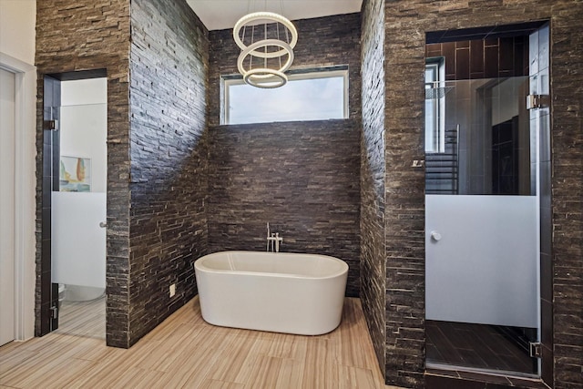 5430 Judalon Ln, Houston, TX 77056 - bathroom with a stall shower, a soaking tub, and a chandelier