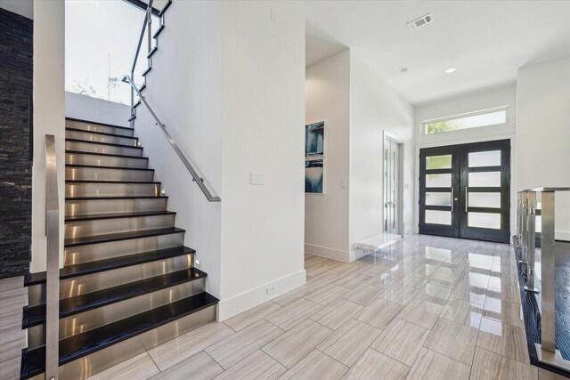 5430 Judalon Ln, Houston, TX 77056 - entryway with stairs, baseboards, french doors, and a towering ceiling