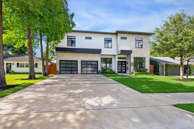 5430 Judalon Ln, Houston, TX 77056 - contemporary home featuring french doors, concrete driveway, a front yard, an attached garage, and stucco siding