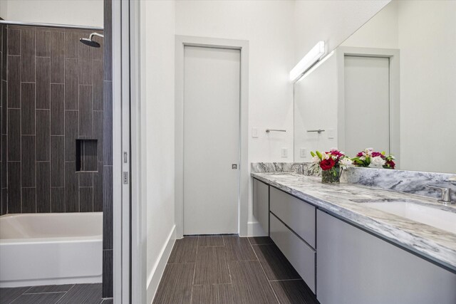 5430 Judalon Ln, Houston, TX 77056 - full bath featuring double vanity, shower / bath combination, and baseboards