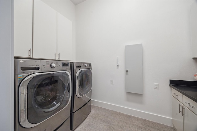 5430 Judalon Ln, Houston, TX 77056 - laundry room featuring washer and dryer, cabinet space, baseboards, and light carpet
