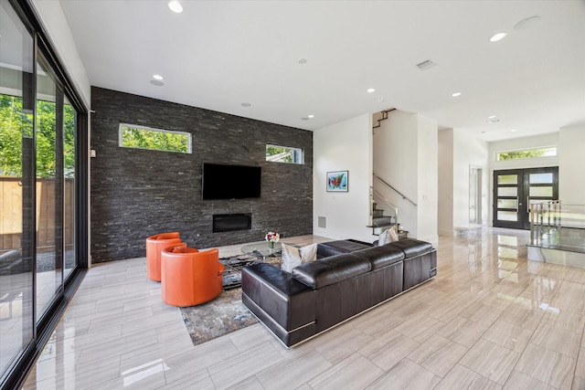 5430 Judalon Ln, Houston, TX 77056 - living area with stairway, a fireplace, plenty of natural light, recessed lighting, and french doors