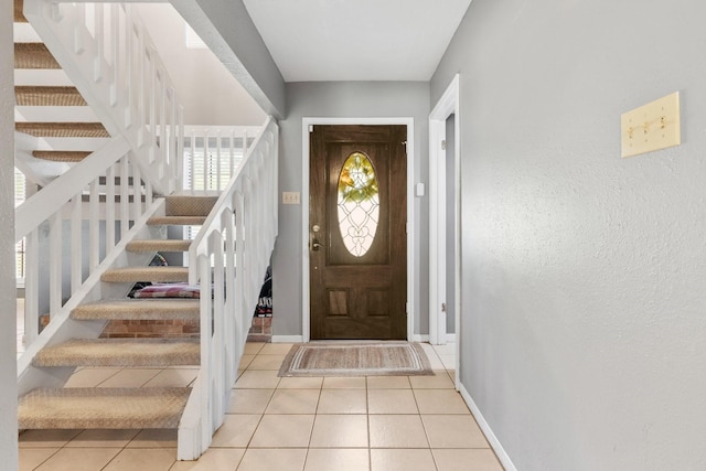 3623 Wells Mark Dr, Humble, TX 77396 - tiled foyer featuring stairs and baseboards