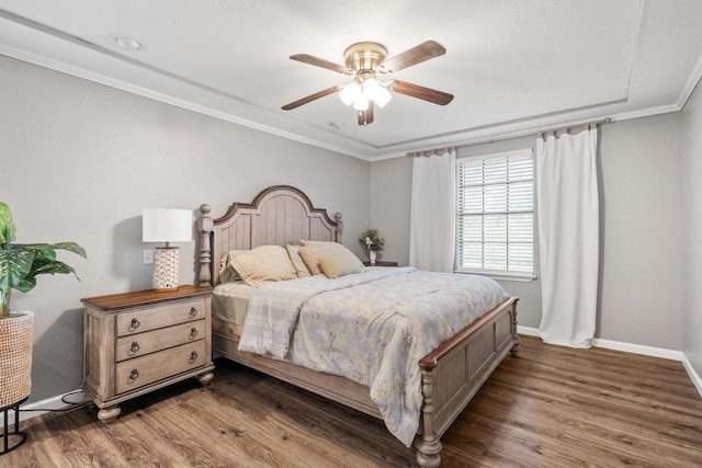 3623 Wells Mark Dr, Humble, TX 77396 - bedroom featuring wood finished floors, baseboards, ornamental molding, and a ceiling fan
