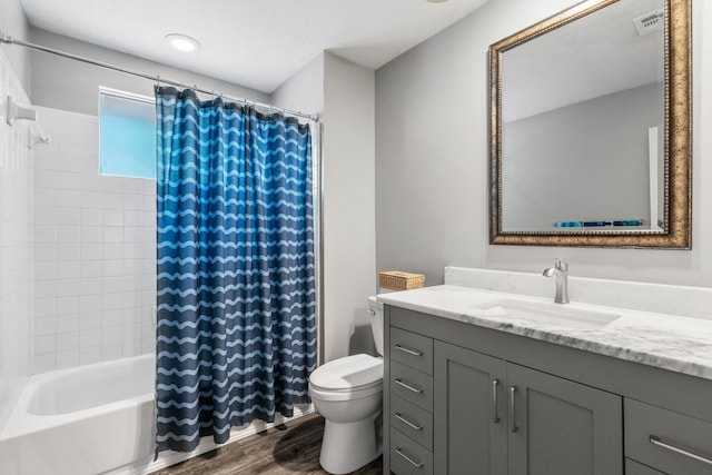3623 Wells Mark Dr, Humble, TX 77396 - full bath featuring toilet, wood finished floors, vanity, and shower / bathtub combination with curtain