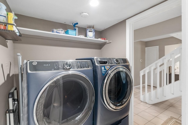 3623 Wells Mark Dr, Humble, TX 77396 - washroom with washing machine and clothes dryer and tile patterned floors