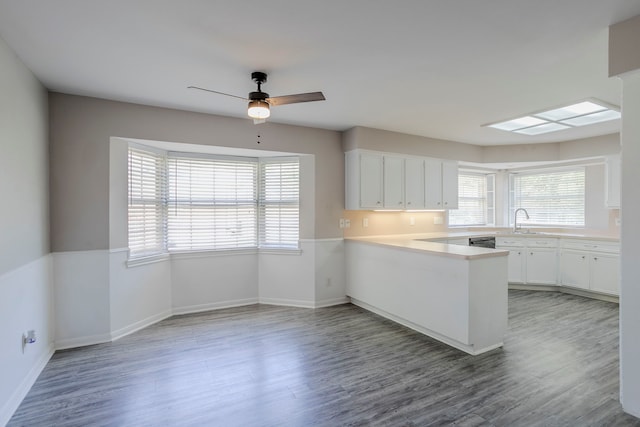 8015 Durklyn Ln, Houston, TX 77070 - kitchen with plenty of natural light, a peninsula, and light wood-style floors