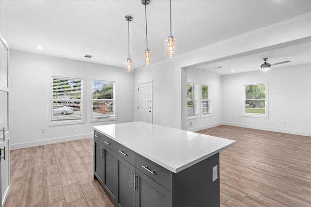 4358 Larkspur St, Houston, TX 77051 - kitchen with healthy amount of natural light, ceiling fan, light countertops, a center island, and recessed lighting