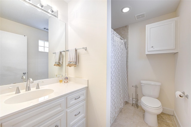 11509 Main Ash, Houston, TX 77025 - bathroom with toilet, vanity, tile patterned floors, baseboards, and recessed lighting