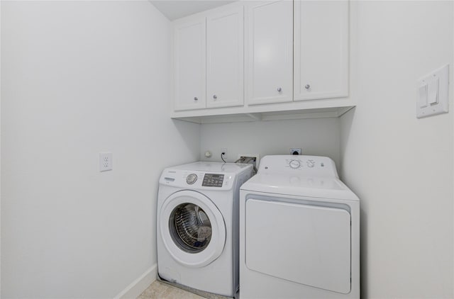 11509 Main Ash, Houston, TX 77025 - laundry area featuring cabinet space, independent washer and dryer, and baseboards