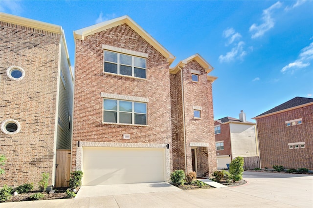 11509 Main Ash, Houston, TX 77025 - view of front of home featuring a garage, driveway, brick siding, and fence