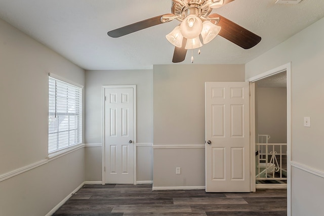 7803 Hurst Forest Dr, Humble, TX 77346 - unfurnished bedroom featuring wood finished floors, a ceiling fan, baseboards, and a closet