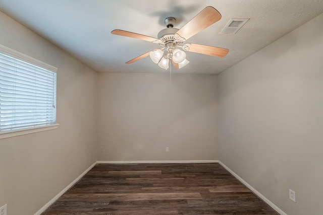 7803 Hurst Forest Dr, Humble, TX 77346 - empty room with wood finished floors, a ceiling fan, and baseboards