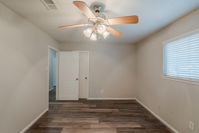 7803 Hurst Forest Dr, Humble, TX 77346 - empty room with wood finished floors, ceiling fan, and baseboards