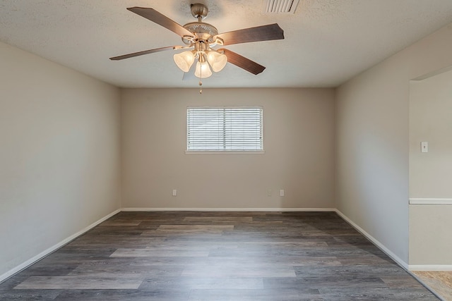 7803 Hurst Forest Dr, Humble, TX 77346 - unfurnished room with ceiling fan, wood finished floors, a textured ceiling, and baseboards
