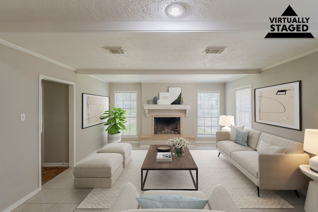 7803 Hurst Forest Dr, Humble, TX 77346 - living room featuring healthy amount of natural light, baseboards, light tile patterned floors, a fireplace with raised hearth, and a textured ceiling