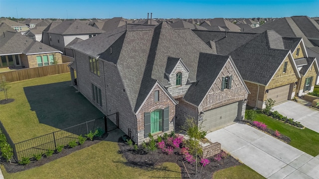 11430 Bush Clover Dr, Cypress, TX 77433 - view of front of home featuring brick siding, driveway, a residential view, a shingled roof, and a garage