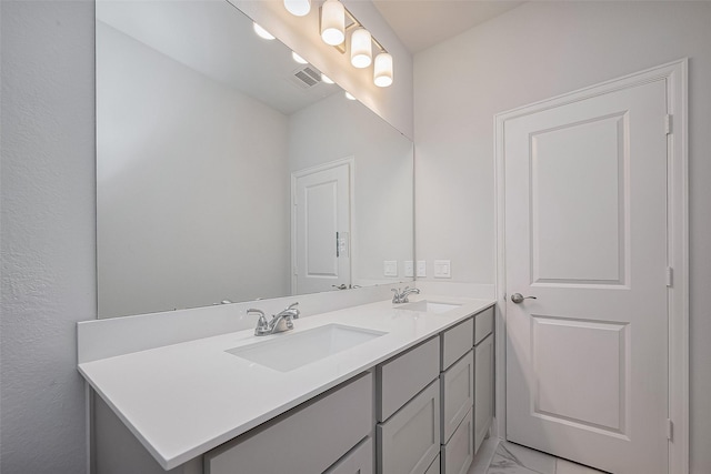 11430 Bush Clover Dr, Cypress, TX 77433 - bathroom featuring double vanity and marble finish floors