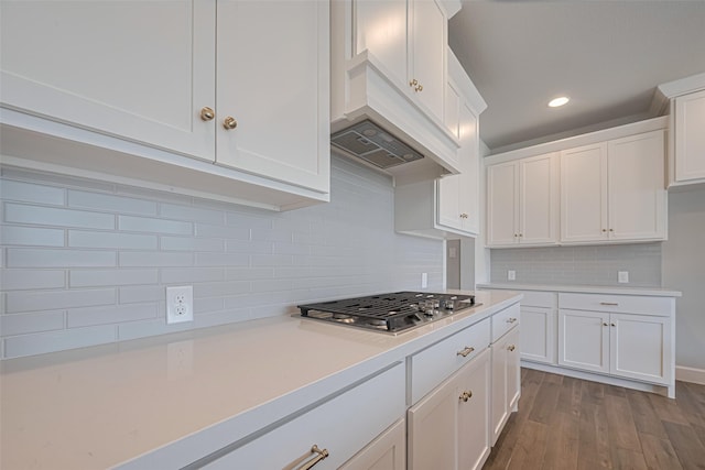 11430 Bush Clover Dr, Cypress, TX 77433 - kitchen with stainless steel gas stovetop, light countertops, white cabinets, wood finished floors, and recessed lighting