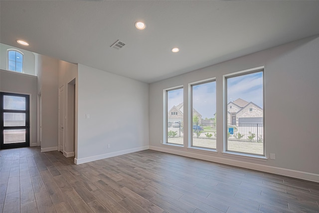 11430 Bush Clover Dr, Cypress, TX 77433 - unfurnished room featuring baseboards, dark wood-style flooring, and recessed lighting