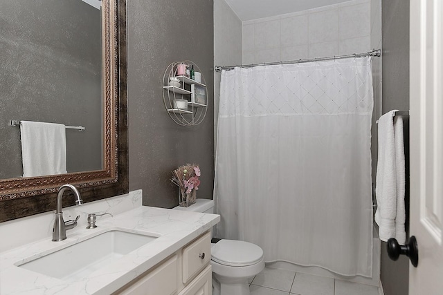 87 S Bluff Creek Cir, The Woodlands, TX 77382 - full bathroom with toilet, vanity, a shower with curtain, tile patterned flooring, and a textured wall