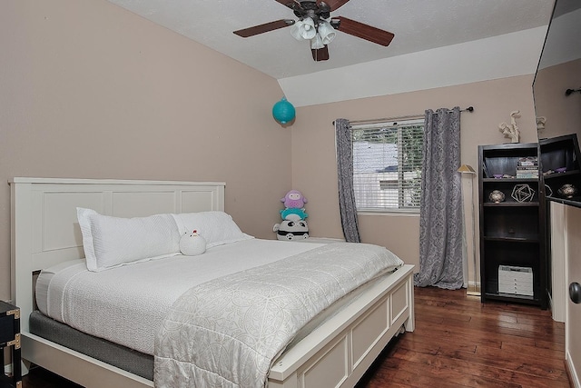 87 S Bluff Creek Cir, The Woodlands, TX 77382 - bedroom with dark wood-style floors, vaulted ceiling, and a ceiling fan