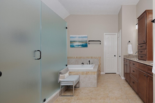 87 S Bluff Creek Cir, The Woodlands, TX 77382 - full bathroom with a bath, a stall shower, tile patterned floors, vanity, and baseboards