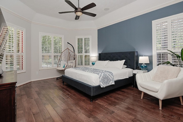87 S Bluff Creek Cir, The Woodlands, TX 77382 - bedroom with wood finished floors, a raised ceiling, a ceiling fan, and baseboards