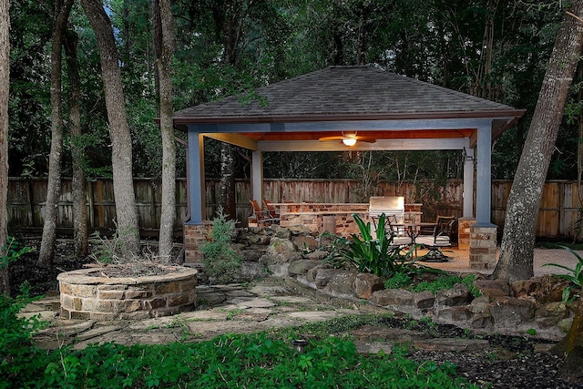 87 S Bluff Creek Cir, The Woodlands, TX 77382 - view of patio featuring a gazebo, an outdoor fire pit, and a fenced backyard