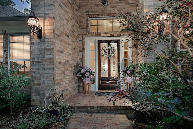 87 S Bluff Creek Cir, The Woodlands, TX 77382 - doorway to property with brick siding