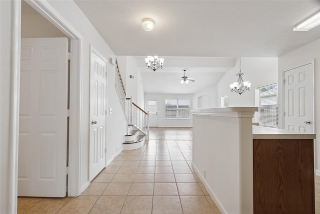 4705 Foster Hill Ct, Houston, TX 77345 - entrance foyer with a chandelier, light tile patterned floors, stairs, and baseboards