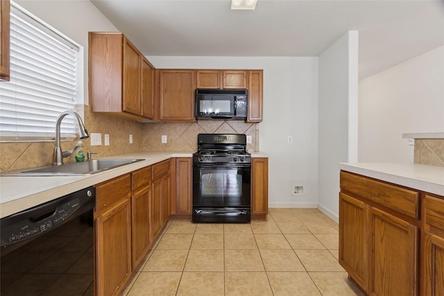 4705 Foster Hill Ct, Houston, TX 77345 - kitchen featuring black appliances, a sink, light countertops, and decorative backsplash